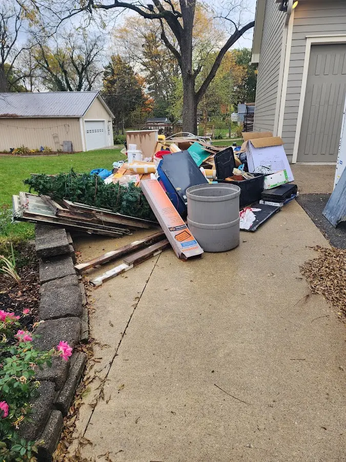 Dumpster being loaded with debris for Commercial Dumpster Rental in Rothschild